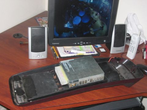 1991 Ford Bronco - A collection of electronic devices and computer components are arranged on a desk surface.