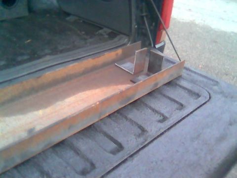 1992 Ford Bronco - Custom metal fabrication part loaded in the bed of a pickup truck.