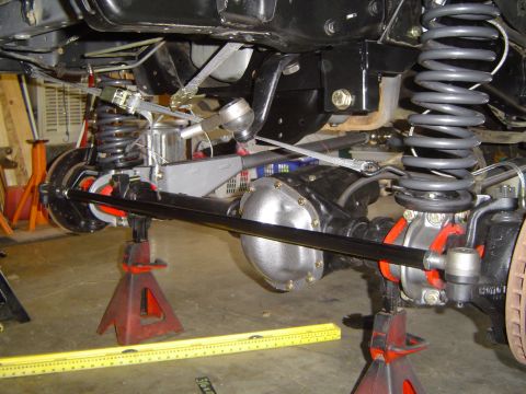 1989 Ford Bronco - Close-up view of vehicle axle and suspension components during installation or repair.