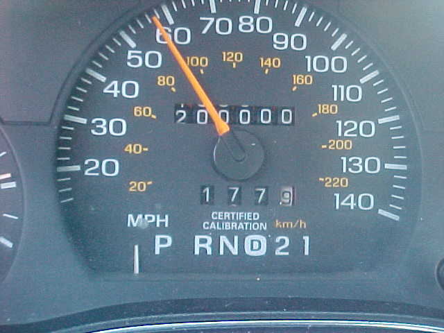 Speedometer close-up showing odometer at exactly 200000 miles and PRNDL gear display