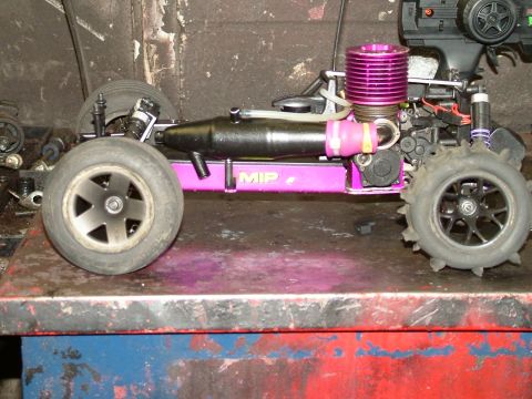 1994 Ford Bronco - This remote control car features a vibrant purple engine and chassis, with MIP branding visible on its side.