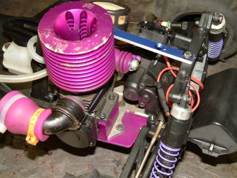1994 Ford Bronco - Close-up of a remote control car's engine and suspension components.