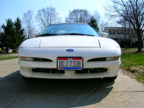 1997 Ford Probe - Front view of a white 1993 Ford Probe parked on a concrete driveway.