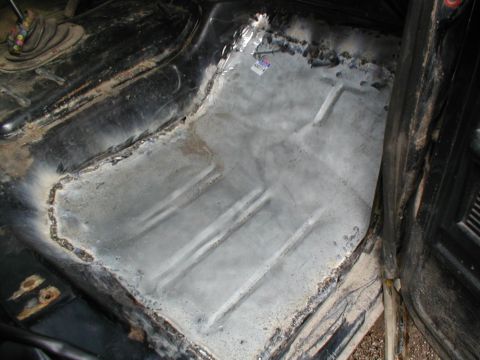 1979 Ford Bronco - Vehicle interior floor pan repair in progress, showing bare metal and welding.