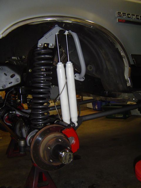1989 Ford Bronco - Close-up of a modified rear axle assembly on a Ford Bronco, showing upgraded suspension components.