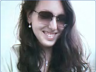1994 Ford Probe - A woman with sunglasses and long dark hair smiles for the camera, with a website address visible.