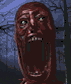 1986 Ford Bronco - A close-up of a frightening, distorted face with an open mouth and visible teeth.