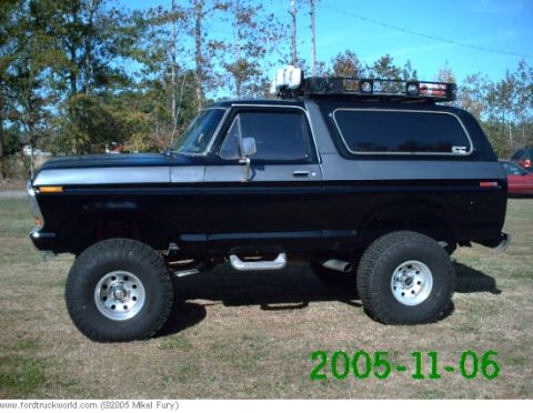 1978 Ford Bronco - Modified 1978 Ford Bronco with a two-tone paint job and off-road modifications.