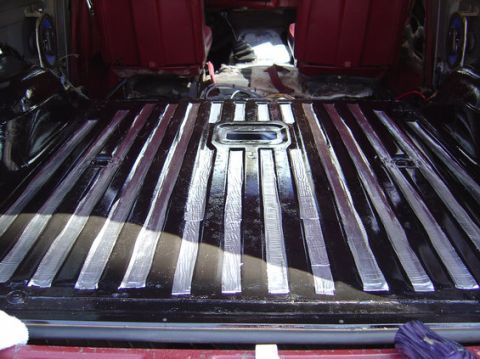 1978 Ford Bronco - Applying sound deadening material to the floor of a 1978 Ford Bronco.