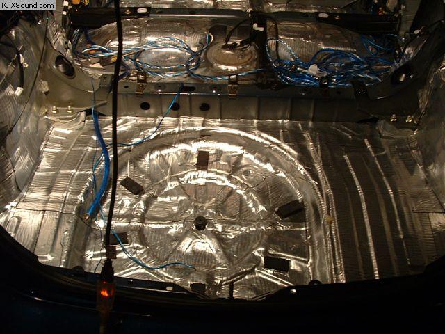 Car's rear interior with sound deadening material and wiring installed