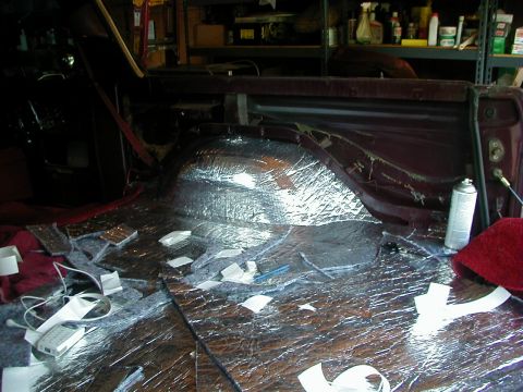 1978 Ford Bronco - Sound deadening material being installed in the rear interior of a 1978 Ford Bronco.
