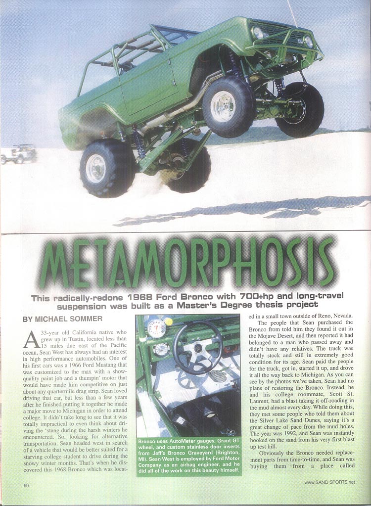 Green 1968 Ford Bronco with extreme suspension, mid-air over sand dunes