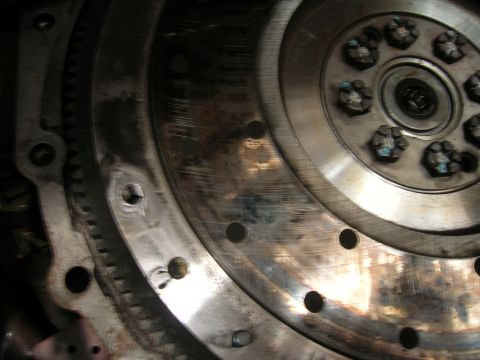 1979 Ford Bronco - Detail of a vehicle's flywheel and starter ring gear, showing mechanical components.