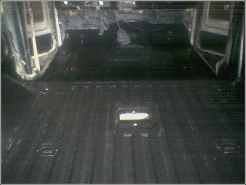 1981 Ford Bronco - The interior of a vehicle, possibly a truck or SUV, appears to be stripped down for work or modification.
