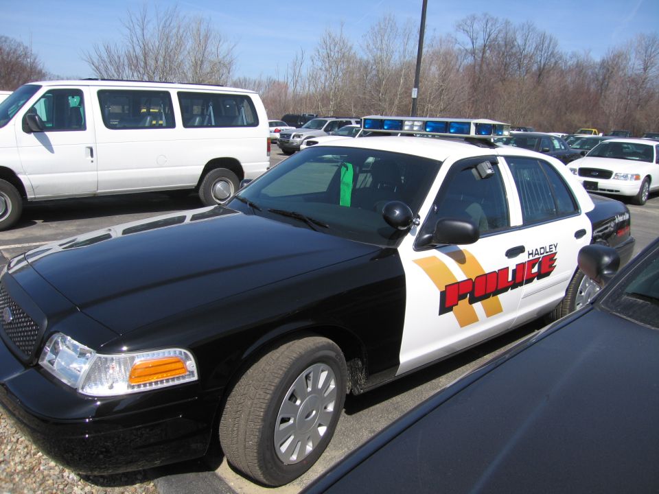 Black and white Ford Crown Victoria Hadley Police cruiser in parking lot