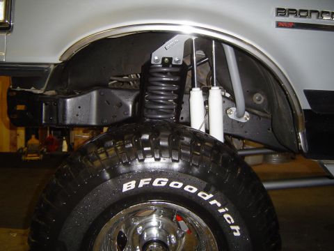 1989 Ford Bronco - Close-up of the front suspension and tire assembly on a 1989 Ford Bronco.