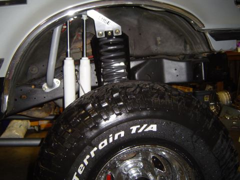 1989 Ford Bronco - Close-up of the rear suspension system on a 1989 Ford Bronco, a coilover shock and dual rear shocks.