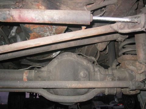 1986 Ford Bronco - Underside view of the front axle and suspension system on a 1986 Ford Bronco.