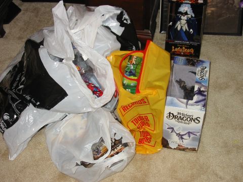 1991 Ford Bronco - A collection of shopping bags and toy packaging sits on a carpeted floor.