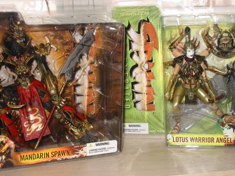 1991 Ford Bronco - Action figures Mandarin Spawn, Spawn, and Lotus Warrior Angel are displayed in their packaging.