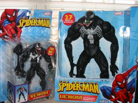 1991 Ford Bronco - Two Venom action figures are displayed, one in blister packaging and the other in a larger box Spider-Man.