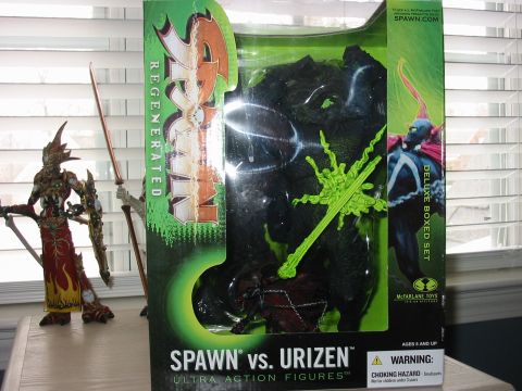 1991 Ford Bronco - A boxed Spawn vs. Urizen action figure set is displayed next to another action figure.