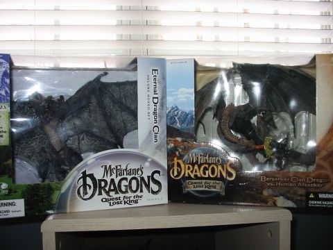 1991 Ford Bronco - Two McFarlane's Dragons toy boxes are displayed, dragon figures and artwork.