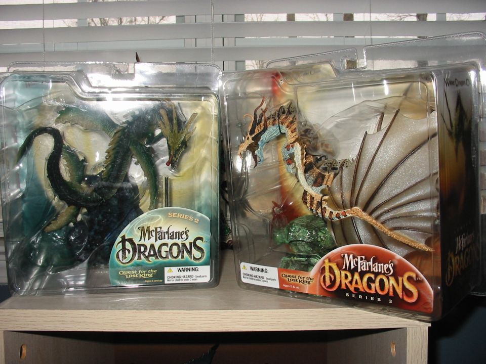 Two McFarlane's Dragons action figures in packaging, Series 2 and Series 3