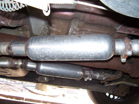 1999 Ford Crown Victoria - Underside view of a vehicle's exhaust system, showing two mufflers.