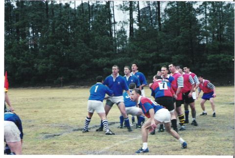 1992 Ford Bronco - A group of men in rugby uniforms are gathered on a field, ready for a game.