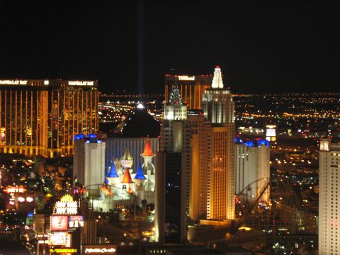 1997 Ford Probe - The Las Vegas Strip is illuminated at night, various hotels and casinos.