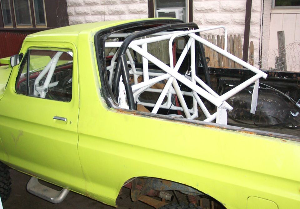 Yellow truck interior with white rollcage