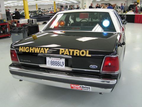 1991 Ford LTD Crown Victoria - Rear view of a Ford LTD Crown Victoria CHP sedan with gold HIGHWAY PATROL lettering and California plate 888849.