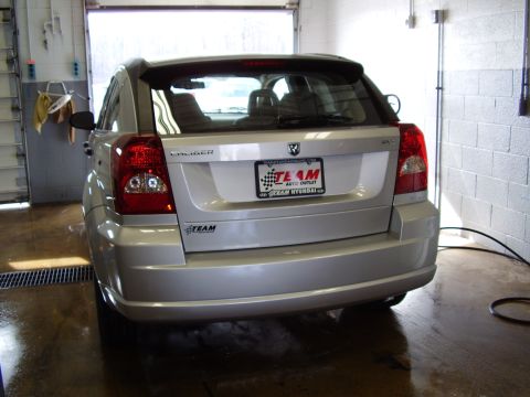 1997 Ford Taurus - Rear view of a silver Dodge Caliber. The vehicle is inside a garage with the door open.