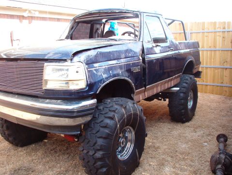 1994 Ford Bronco - The truck was damaged when it was driven slowly along the edge of a packed parking lot during a light rain. An adjacent construction site h…