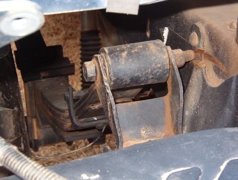 1994 Ford Bronco - These bolts are installed backward, and they've cut thru the shackle brackets.