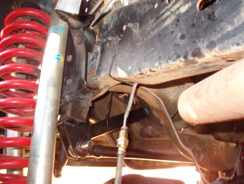 1994 Ford Bronco - The track arm bracket broke away from the frame because it wasn't braced, so the repair shop added the square tube & brace. Note the dangli…