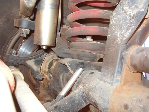 1994 Ford Bronco - The sway bar probably caused this shock to break. The upper mount for the radius arm (in the lower R of the photo) is rusting.