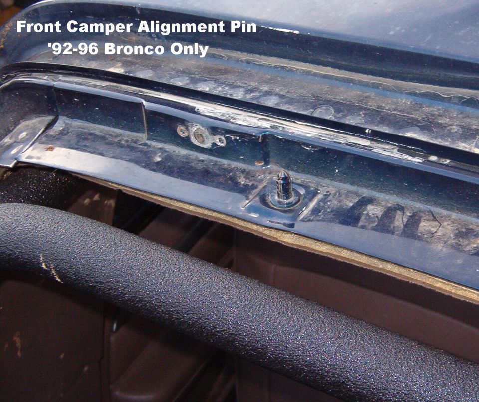 This pin aligns the front of the '92-96 camper shell.  It is only used on the L side.  Both sides have a captive threaded steel plate for the bolt. The camper shell has 2 more pins that fit into slots in the '92-96 bedrails (shown in the NEXT pic).