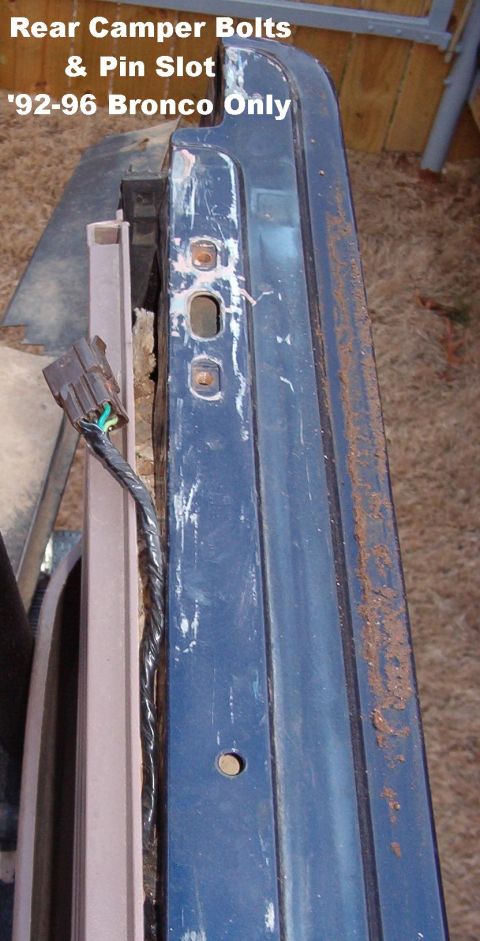 1983 Ford Bronco - These bolt holes are for the integral roll bar in the camper shell, and the captive nut plates are visible in them. The slot between them i…