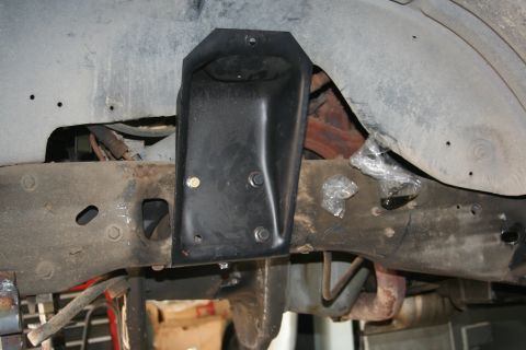 1992 Ford Bronco - the 79 coil towers - about 1.125 " forward -see right up aginst the xmember rivet