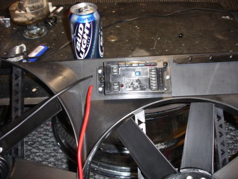 1996 Ford Bronco - A Flex-a-lite fan control module is shown next to a can of Bud Light, with wiring and fan blades visible.