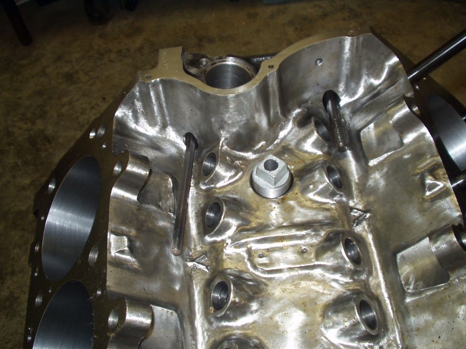 Close-up of an engine block's internal passages and bolt holes