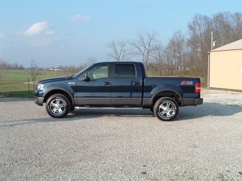 2005 Ford F-150 - This 2005 Ford F-150 pickup truck is shown in a side profile, FX4 off-road badging on the rear fender.