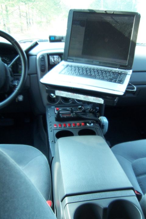 2005 Ford Explorer - Interior view of a 2005 Ford Explorer, a laptop mount and communication equipment.