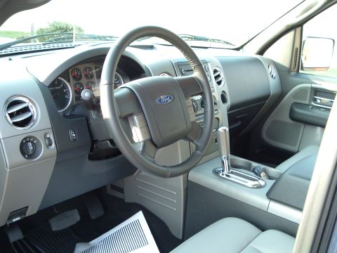 2005 Ford F-150 - The interior of a Ford F-150 pickup truck is visible, the steering wheel and dashboard.