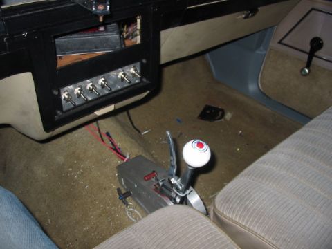 1985 Ford Crown Victoria LTD - The interior features an aftermarket shifter and a panel of toggle switches, suggesting modifications.