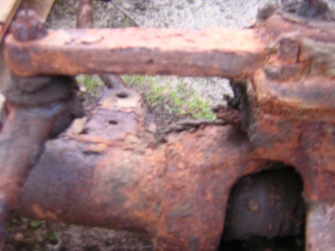 1979 Ford Bronco - This heavily rusted vehicle axle part shows significant corrosion and structural damage.