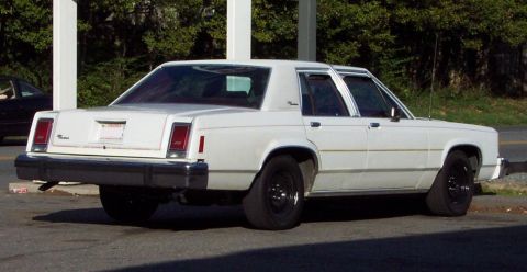 1985 Ford Crown Victoria LTD - This 1985 Ford Crown Victoria LTD sedan is seen from the rear three-quarter angle.