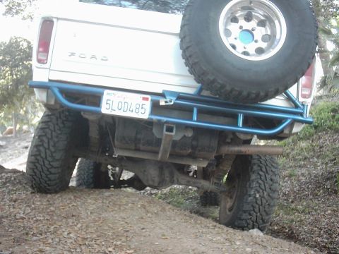 1978 Ford Bronco - This 1978 Ford Bronco features a custom blue roll cage and a spare tire mounted on the rear.